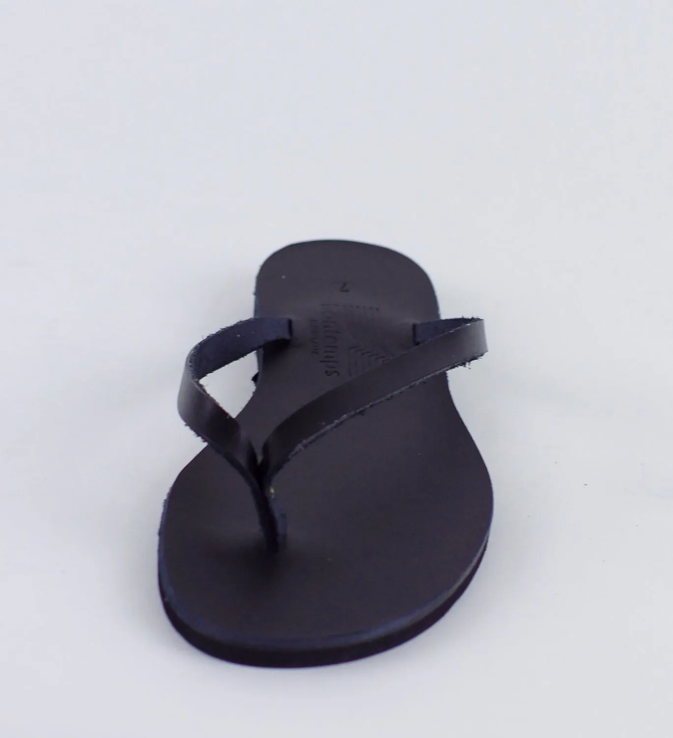 APHRODITE BLACK LEATHER FLIP-FLOPS