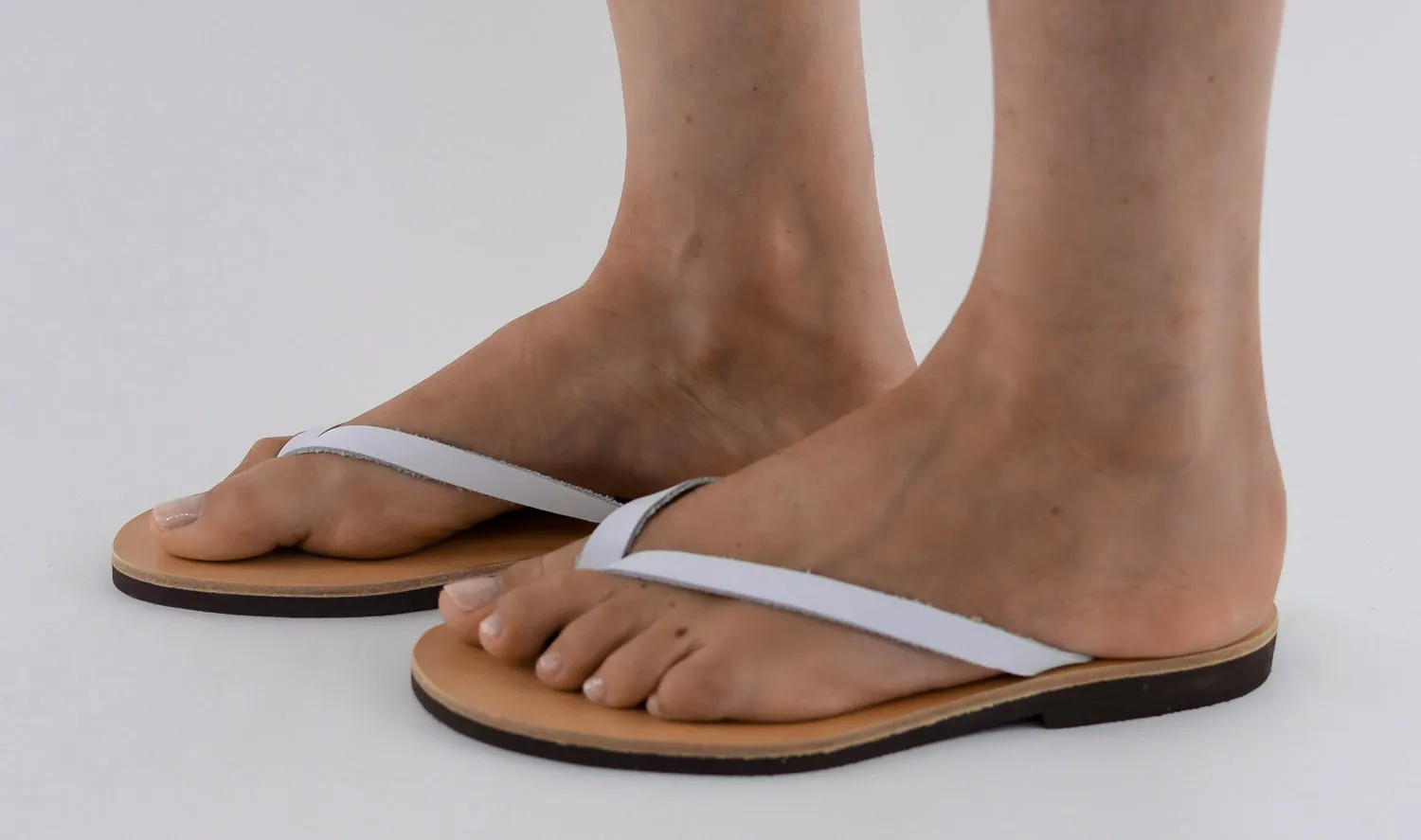 APHRODITE WHITE LEATHER FLIP-FLOPS