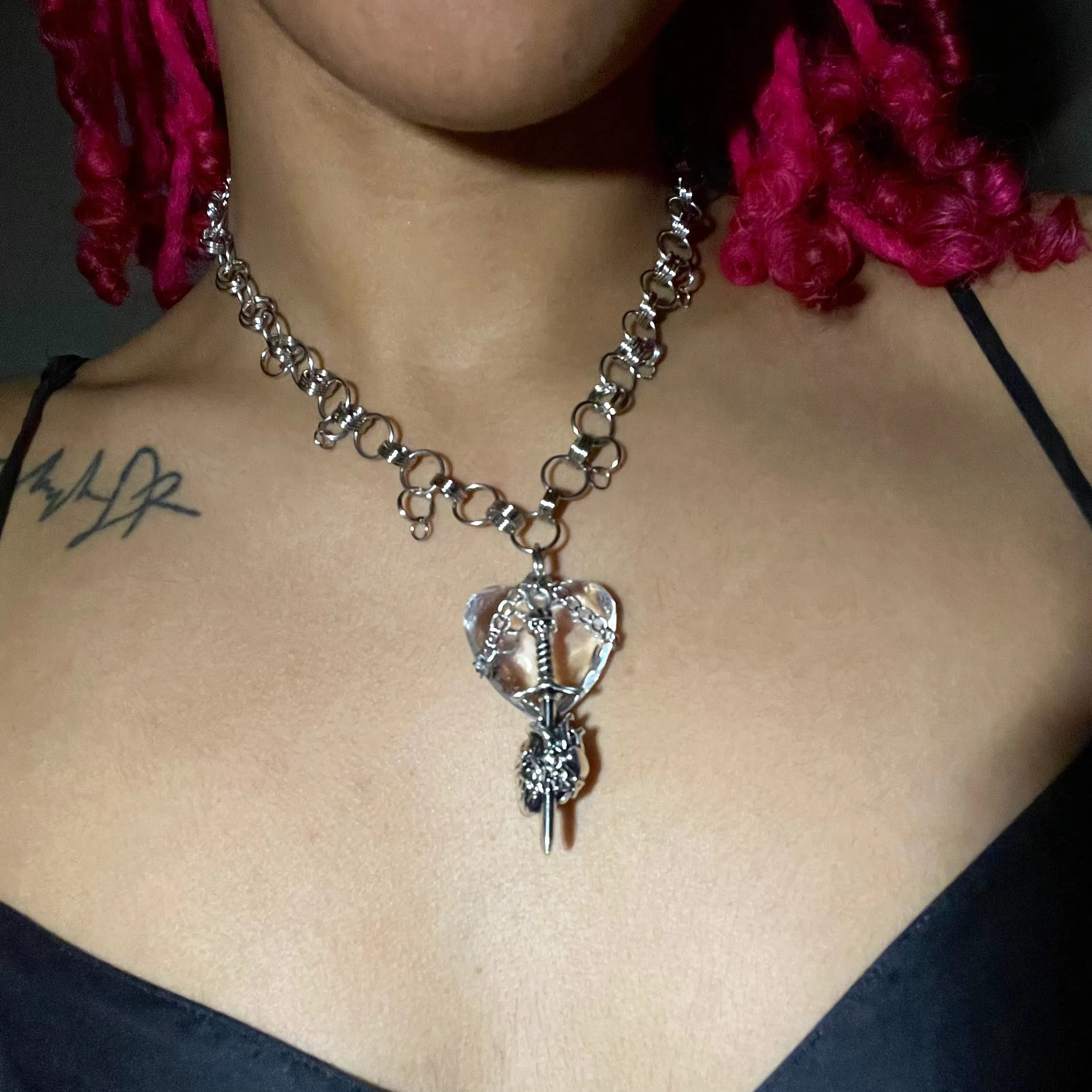 crystal heart sword necklace.