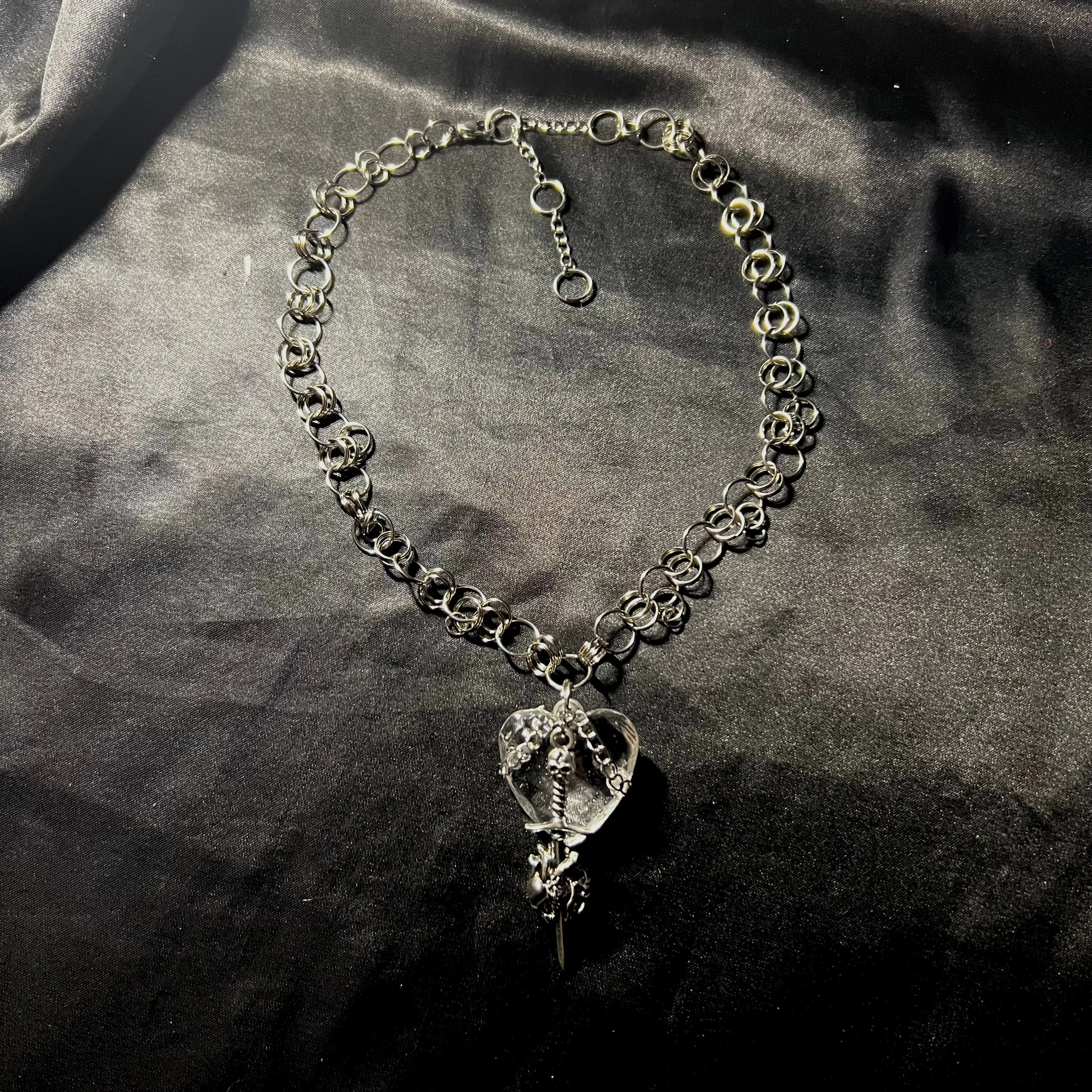 crystal heart sword necklace.