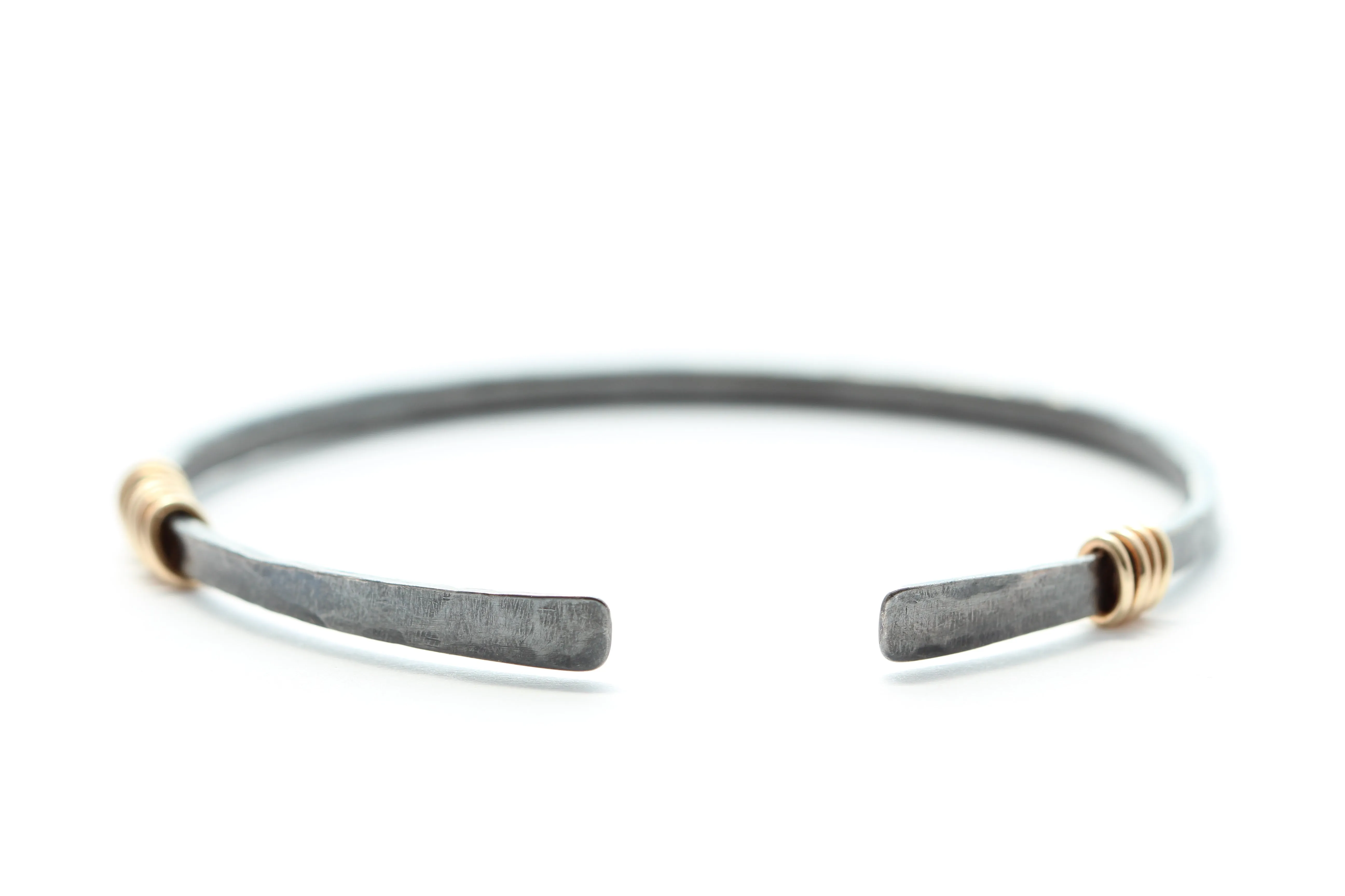Sterling silver bracelet with 14k gold rings
