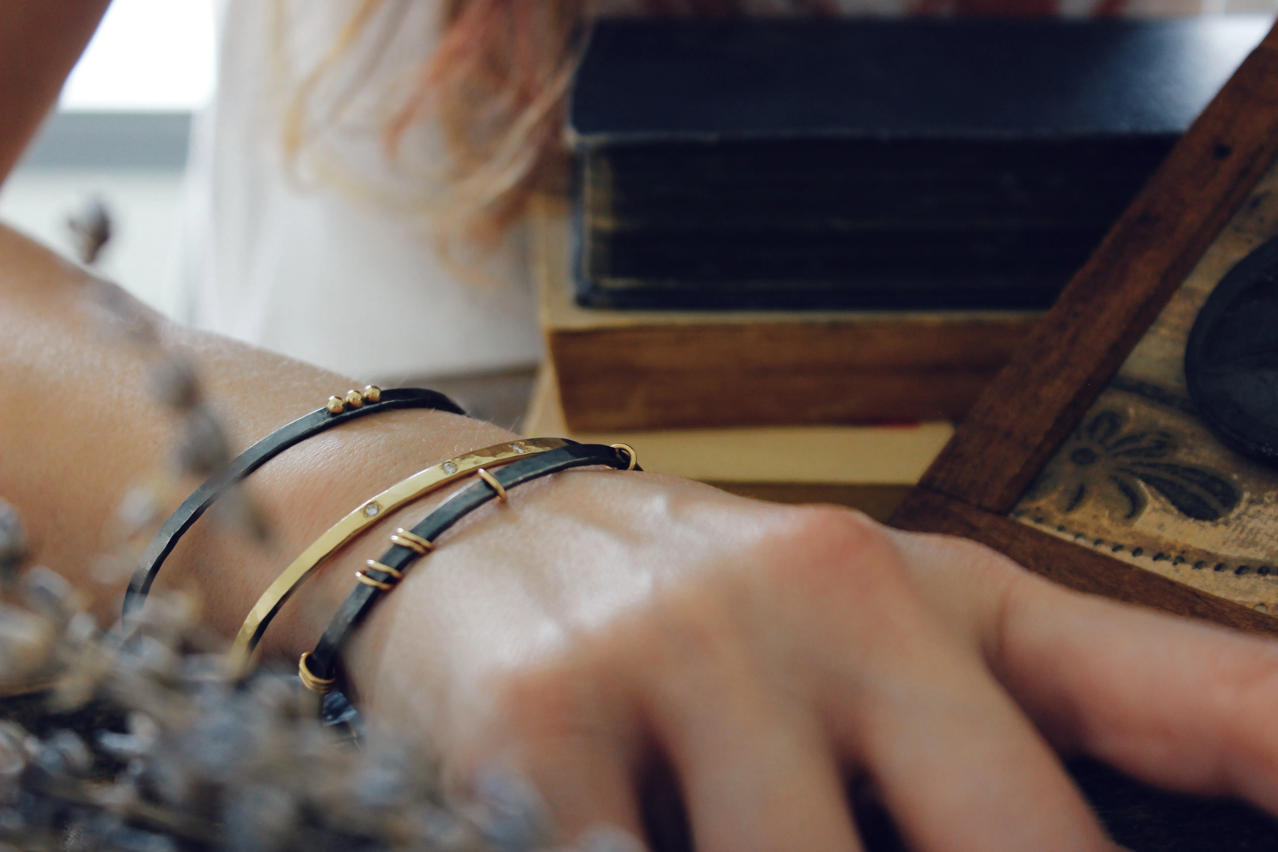 Sterling silver bracelet with 14k gold rings
