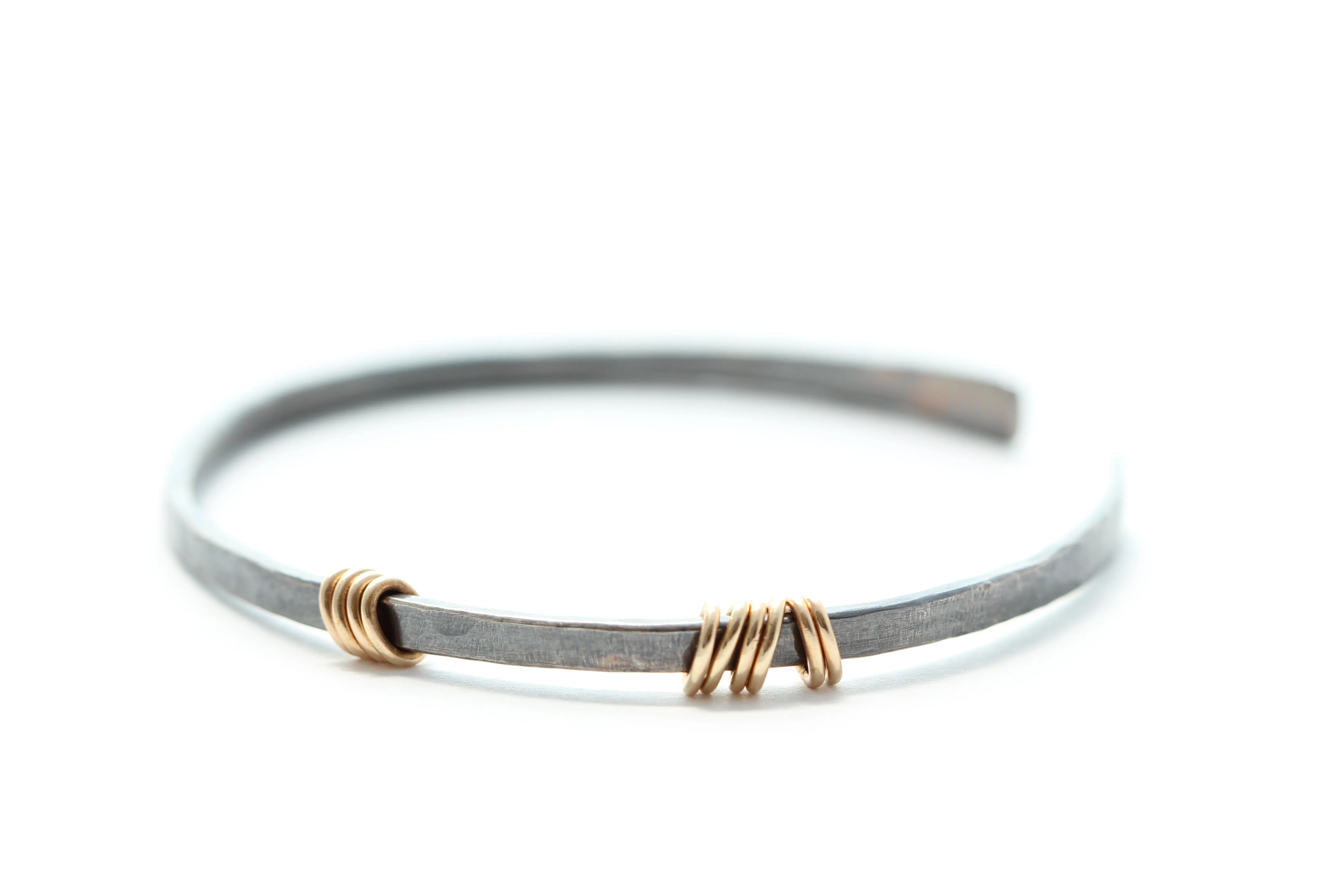 Sterling silver bracelet with 14k gold rings