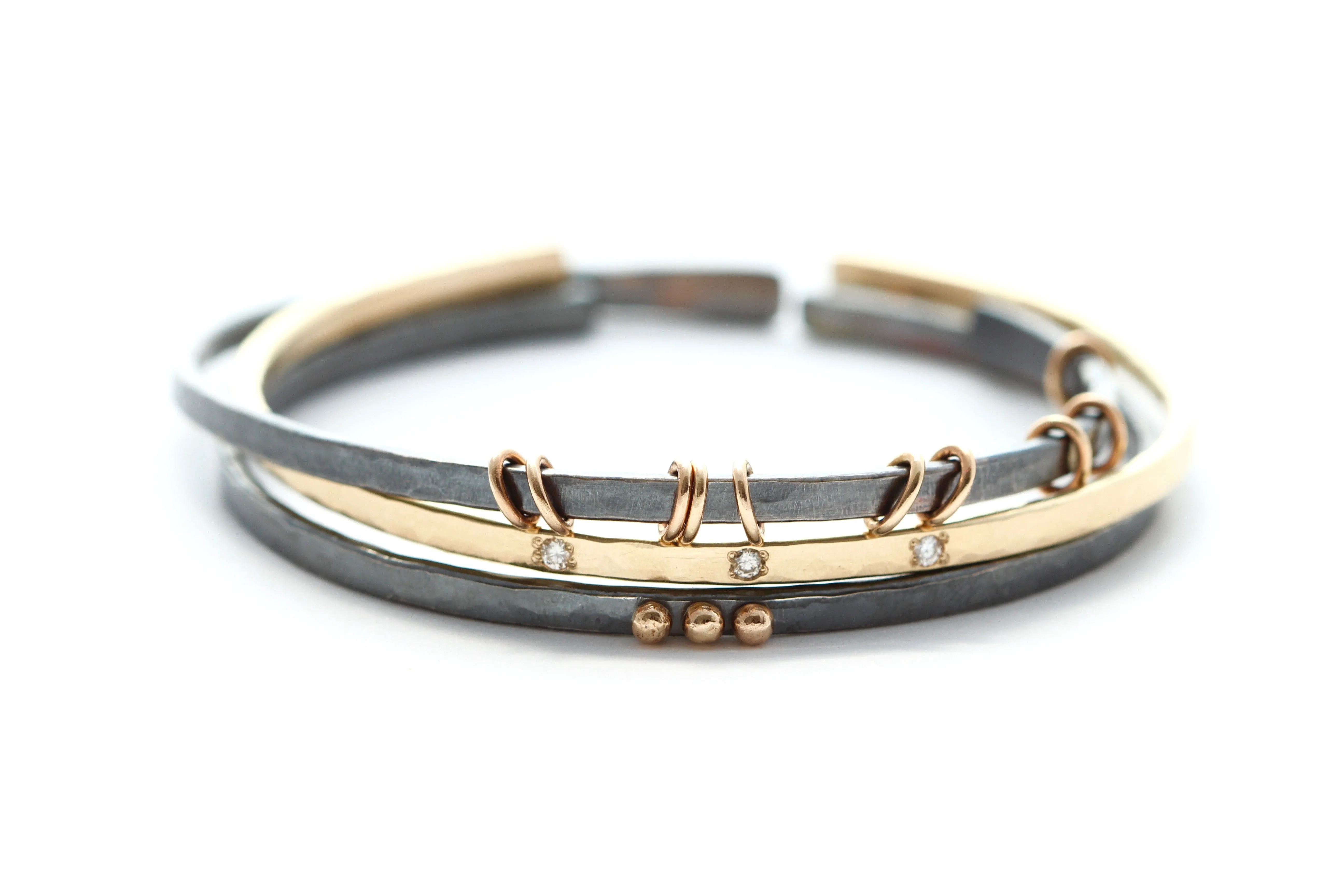 Sterling silver bracelet with 14k gold rings