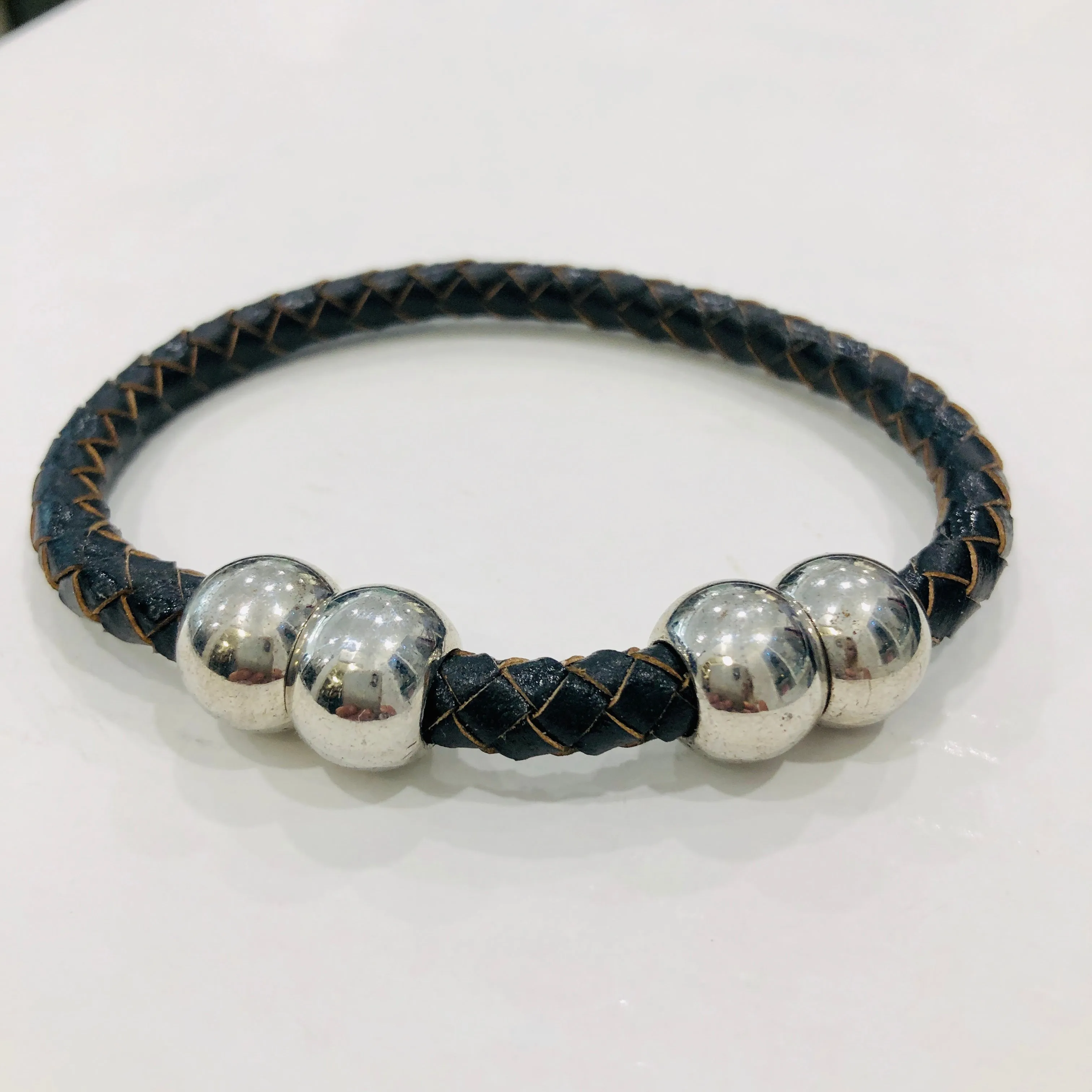 TM. Leather Plait Four Ball Bracelet
