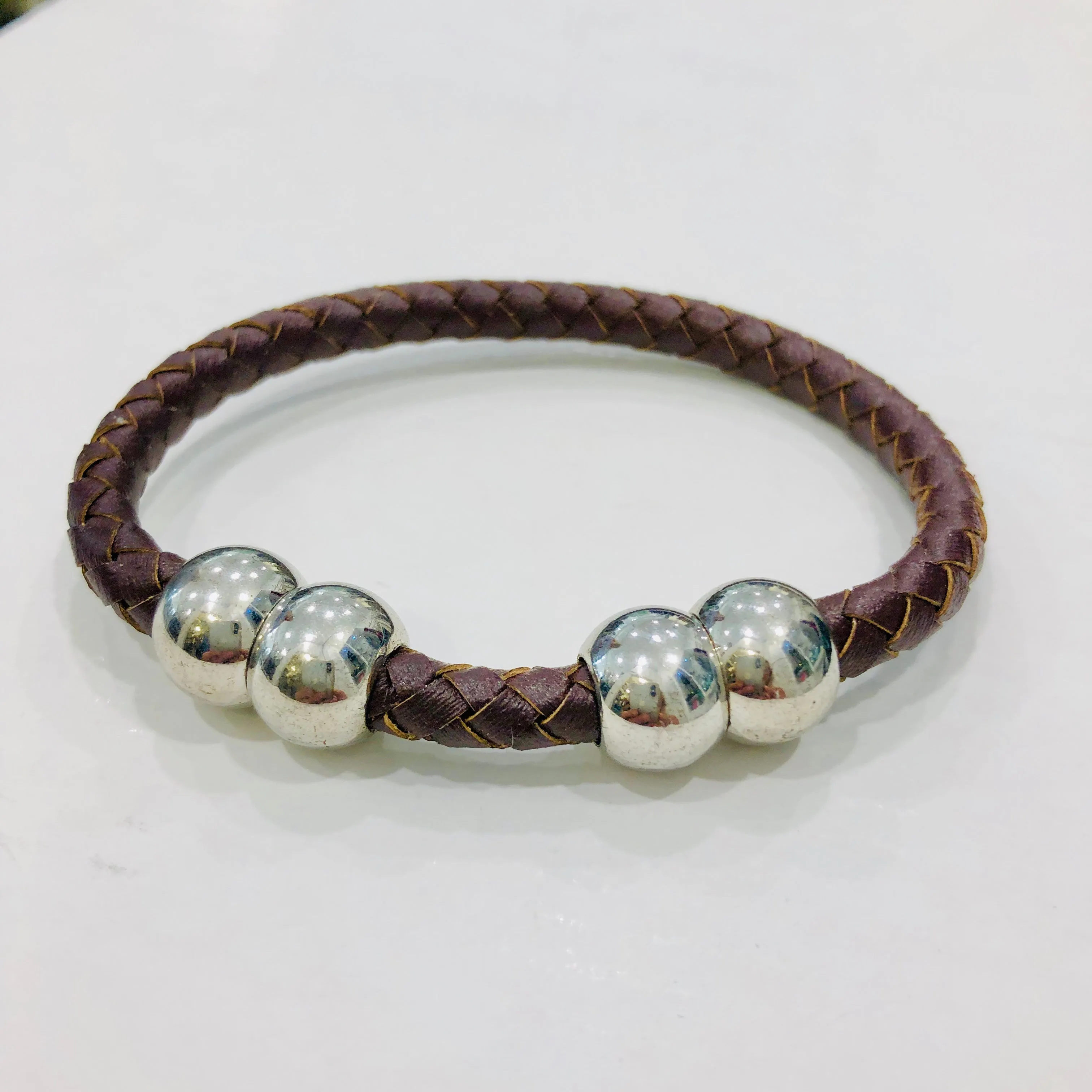TM. Leather Plait Four Ball Bracelet